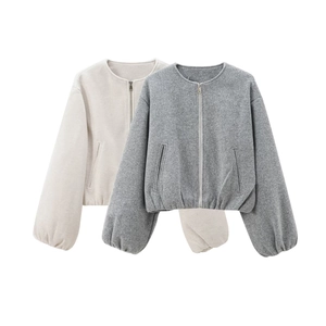 Flat lay detail of beige and grey bomber jackets with zip closure and elastic cuffs