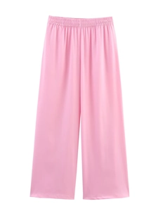 Detail view of the high-waisted elastic waistband on pink satin wide-leg pants