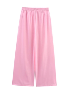 Detail view of high-waisted pink wide-leg pants featuring an elastic gathered waistband