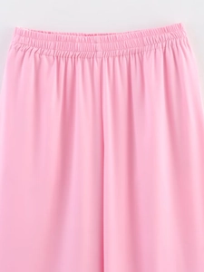 Detail of pink elastic drawstring waistband with premium pleated satin fabric texture