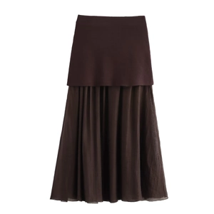 Detail of dark brown double-layer maxi skirt with pleated chiffon and A-line silhouette