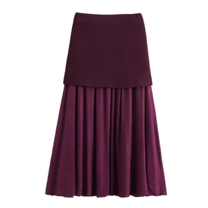 Macro view of tiered pleated deep purple maxi skirt with fine textured fabric details