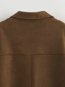 Detail of the back stitching and matte texture on a brown faux suede blazer jacket