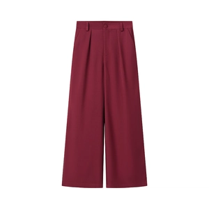 Close-up of high-waist burgundy wide-leg trousers with front pleats and side pockets
