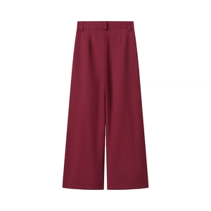 Detail view of burgundy high-waisted wide-leg trousers with back pleats and belt loops
