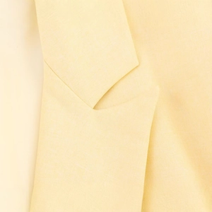 Women's stylish loose fit light yellow blazer with classic notched lapels and textured fabric