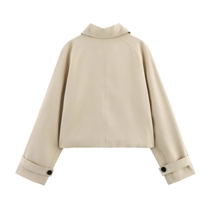 Back view of light khaki short windbreaker jacket with raglan sleeves and buckled cuffs