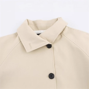 Women's classic light khaki short trench coat with notched lapel and black buttons