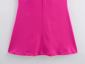 Detailed macro shot of the rose red A-line dress hem with precise stitching and seams