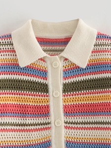 Close-up of crochet polo collar and colorful striped knit texture with buttons