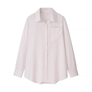 Detail of pink striped shirt showing the lace trim on chest pocket and sleeve cuffs