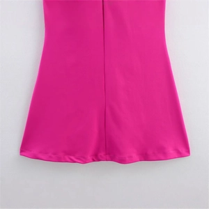 Close-up of rose pink slim fit dress showing smooth fabric hem and vertical stitching detail