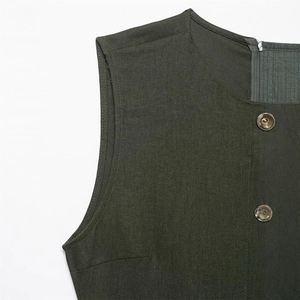 Slim fit sleeveless dark green dress featuring a round neck and amber textured buttons