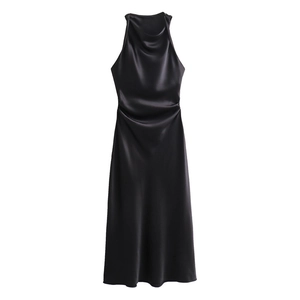 Detailed close-up showing the glossy black satin fabric and draped cowl neckline of the dress