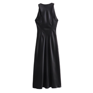 Close-up of elegant black satin sleeveless dress showing smooth fabric and waist pleats
