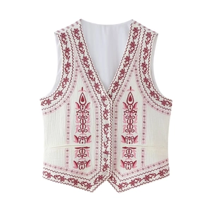 Detailed embroidery on a vintage style sleeveless vest with red floral patterns