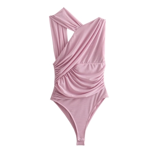 Detailed close-up of pink one-shoulder bodysuit featuring ruched fabric and asymmetric design
