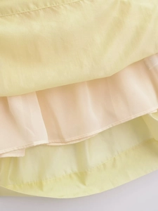 Detailed layered hem of this fashion pleated midi slip dress in pale yellow fabric