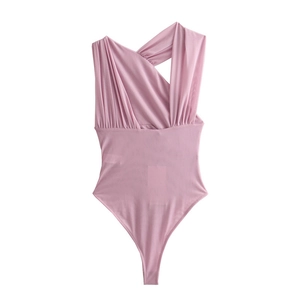 Detail of pink asymmetric one-shoulder bodysuit showing elegant pleated fabric textures