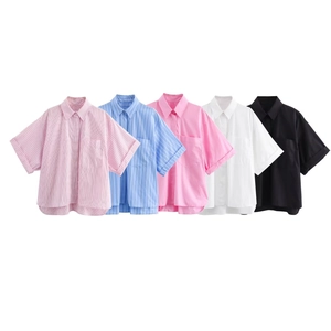 Detail view of five casual short-sleeve collared shirts in solid colors and stripes