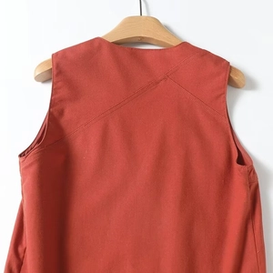 Detailed back view of a terracotta sleeveless top with unique diagonal stitching
