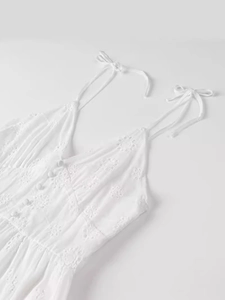 White broderie anglaise sundress with spaghetti straps and floral embroidery details