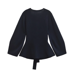 Navy blue long sleeve knit top with puff sleeves and ruffled peplum hem waist tie