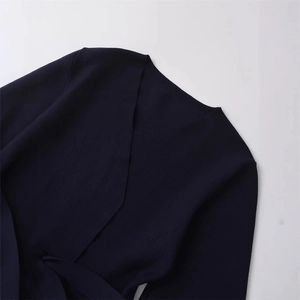 Navy blue V-neck knit top for women with crossover wrap design and matching waist belt