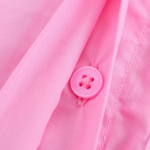 Close-up of pink casual shirt fabric texture and matching color four-hole button detail
