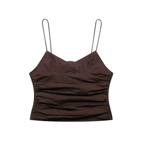 Detail of dark brown camisole featuring intricate horizontal pleats and thin straps