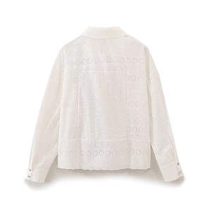 Detailed back view of white long sleeve shirt with intricate hollow embroidery and lapel