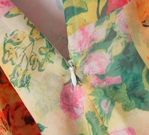 Detail of the invisible zipper and high-quality floral fabric on the summer dress