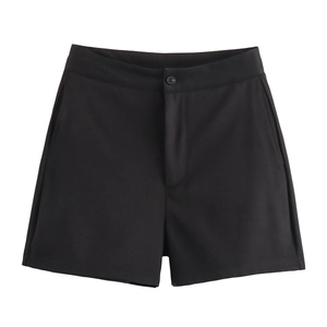 Detailed view of women black high-waisted tailored shorts with clean resin button closure