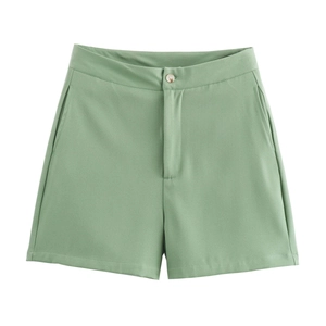 Detail of sage green high-waisted shorts with button closure and smooth woven fabric