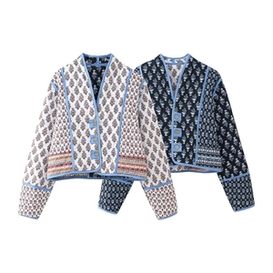 Detail of vintage Y2K reversible quilted jackets with floral print and wood buttons