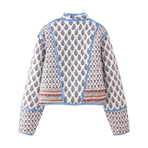 Back view of reversible quilted jacket with purple floral print and ethnic pattern trim