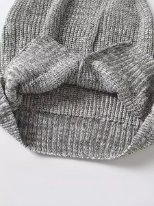Minimalist short knit vest for women in grey marl fabric showing textured rib stitch