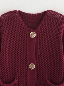 Women's burgundy chunky knit cardigan with hollow design and golden texture buttons