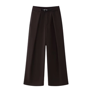 Detail of high waisted wide leg trousers with slim belt and elegant pleated waist design