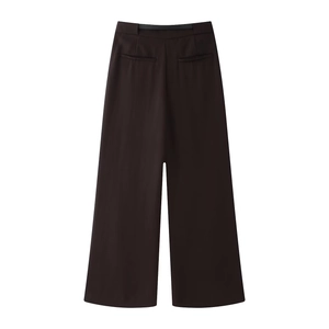 Detail view of high waist wide leg trousers in deep brown with back pocket design
