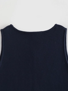 Detailed view of the fine knitting texture and seamless neckline of this navy vest