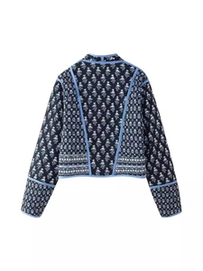 Back view of a Y2K reversible quilted puffer jacket with vintage floral patterns