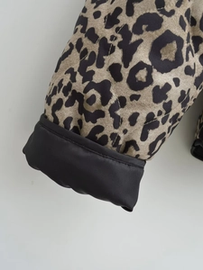 Quilted leopard print jacket with textured twill fabric and black cuff details