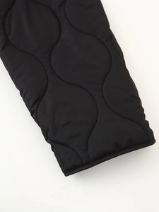 Women's black onion quilted autumn jacket with ribbed cuffs and loose fit design