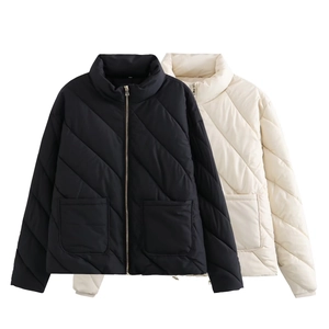 Quilted cotton jackets in black and off-white with high collar and gold metal zipper