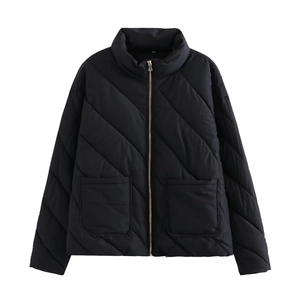 Detailed view of black quilted jacket featuring stand collar and large front pockets