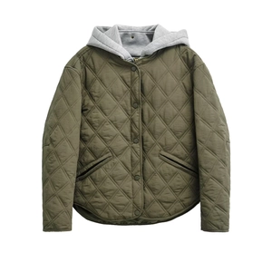 Detail of army green quilted jacket with diamond stitching and grey hooded lining