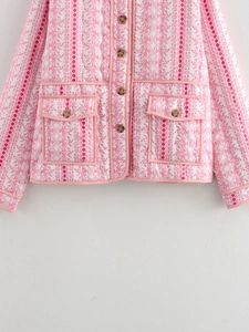 Detailed view of single-breasted floral quilted jacket with large flap pockets and pink piping