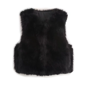 Detailed view of dense black faux fur texture and smooth inner lining of the vest