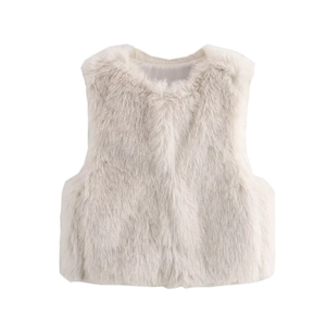 Close-up of fluffy faux fur texture and smooth inner lining on cream white vest